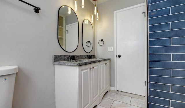 4589 Annhurst Rd, Columbus, OH 43228 - bathroom with tile patterned floors, vanity, and toilet