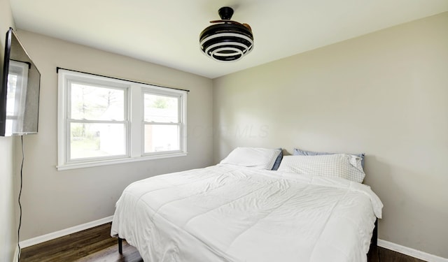 4589 Annhurst Rd, Columbus, OH 43228 - bedroom featuring baseboards and wood finished floors