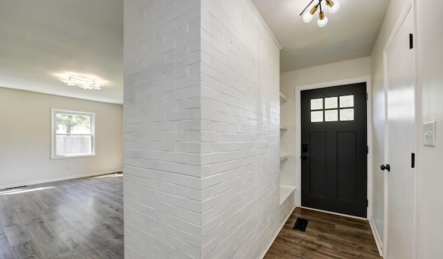 4589 Annhurst Rd, Columbus, OH 43228 - entryway with wood finished floors, healthy amount of natural light, and baseboards