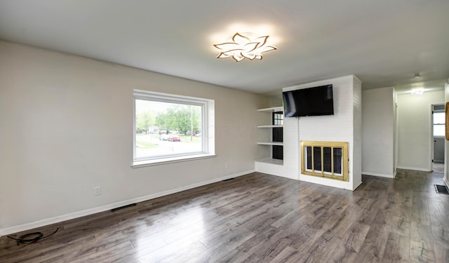 4589 Annhurst Rd, Columbus, OH 43228 - unfurnished living room featuring dark wood finished floors, a fireplace, and baseboards