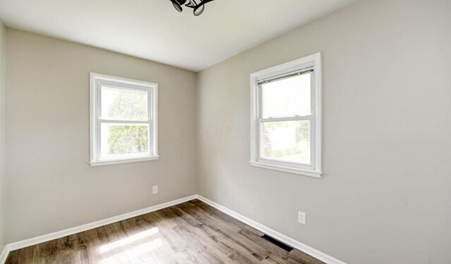 4589 Annhurst Rd, Columbus, OH 43228 - spare room featuring plenty of natural light, baseboards, and wood finished floors