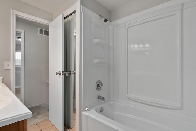 full bathroom featuring shower / bath combination, vanity, and tile patterned flooring
