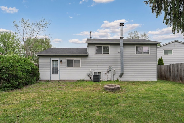 back of house featuring an outdoor fire pit