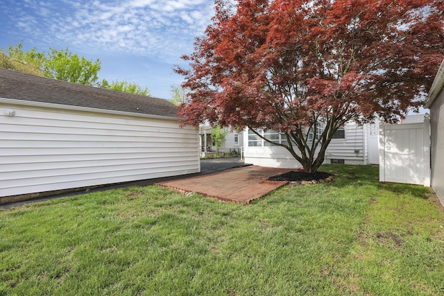 view of yard featuring a patio and fence