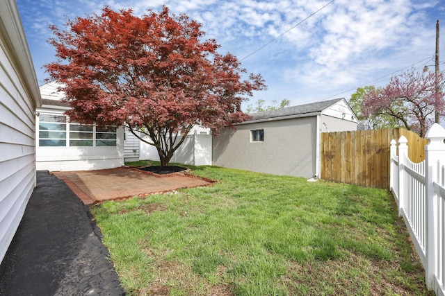view of yard with a fenced backyard and a patio area