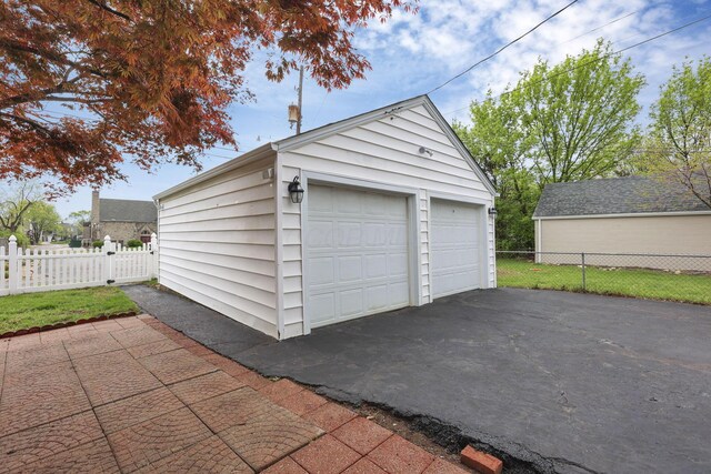 detached garage with fence