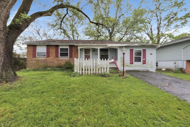 5143 Rutledge Dr N, Columbus, OH 43232 - ranch-style house with aphalt driveway, brick siding, and a front yard