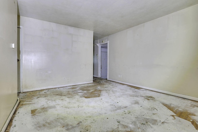 5143 Rutledge Dr N, Columbus, OH 43232 - spare room with baseboards and concrete floors