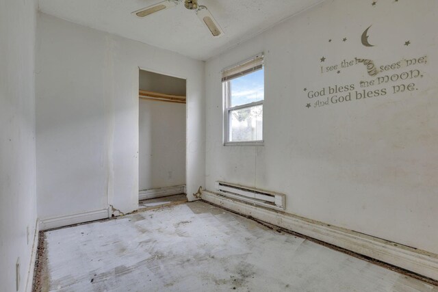 5143 Rutledge Dr N, Columbus, OH 43232 - unfurnished bedroom with a closet, a baseboard radiator, and a ceiling fan