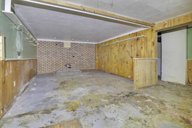 5143 Rutledge Dr N, Columbus, OH 43232 - below grade area featuring wooden walls and brick wall