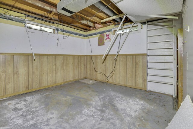 5143 Rutledge Dr N, Columbus, OH 43232 - unfinished below grade area featuring wooden walls and wainscoting