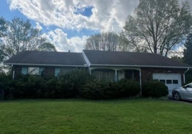 1455 Fairview Ave, Bucyrus, OH 44820 - single story home with a garage and a front yard
