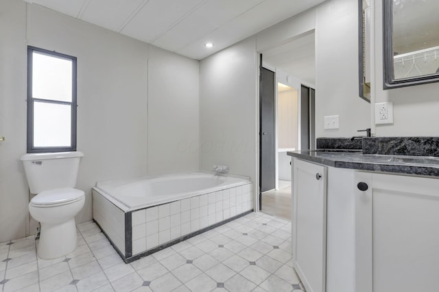 full bath featuring vanity, a garden tub, toilet, recessed lighting, and tile patterned floors
