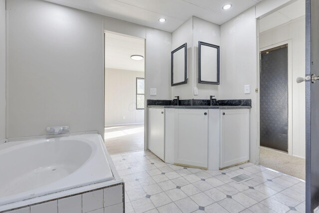 2445 Columbus Lancaster Rd NW, Lancaster, OH 43130 - full bath with a garden tub, double vanity, and recessed lighting