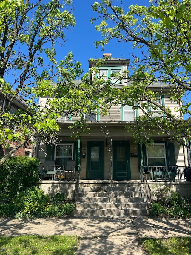 italianate house featuring a porch