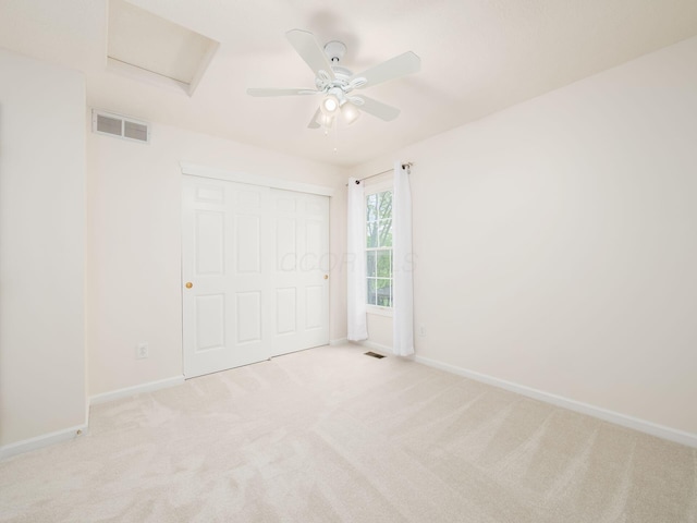 5068 Shadow Woods Ct, Powell, OH 43065 - unfurnished bedroom featuring carpet, attic access, baseboards, ceiling fan, and a closet