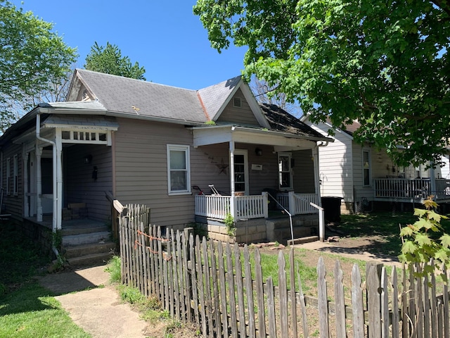 167 Fountain St, Logan, OH 43138 - bungalow-style house with covered porch, a shingled roof, and fence private yard