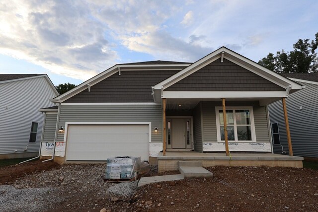 378 Canterbury Rd, Commercial Point, OH 43116 - view of front of property with a porch, an attached garage, and driveway