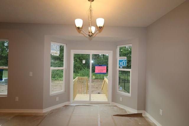 378 Canterbury Rd, Commercial Point, OH 43116 - doorway to outside with plenty of natural light and a chandelier