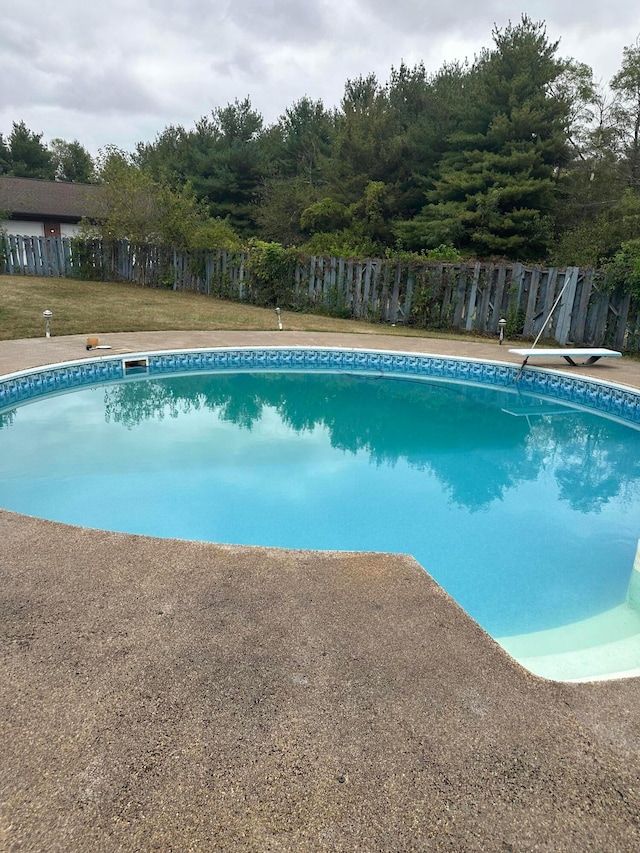 view of swimming pool with fence and a fenced in pool