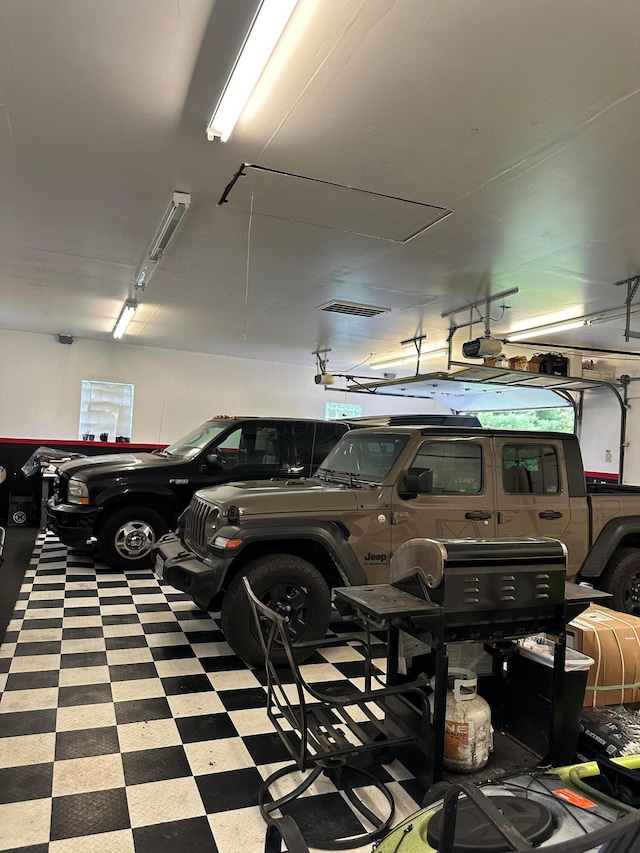 garage featuring a garage door opener