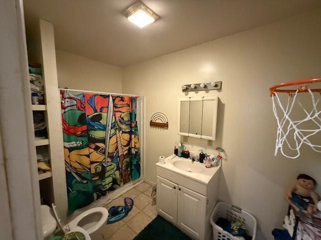 bathroom featuring vanity, a shower with curtain, and tile patterned floors
