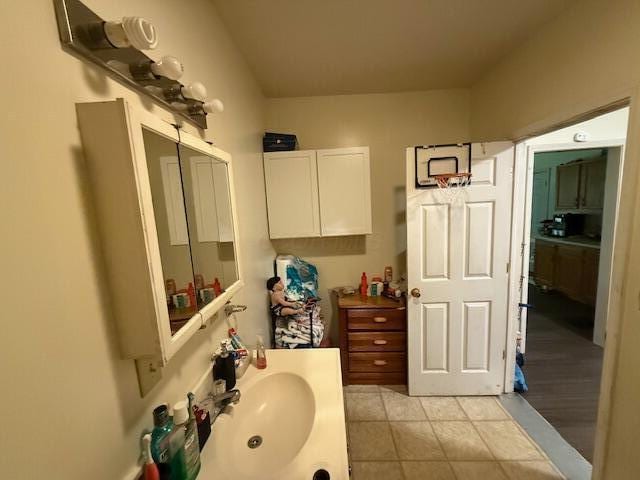 bathroom featuring a sink and tile patterned floors