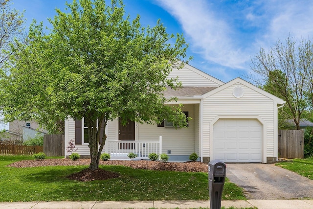 view of front of property featuring a garage, fence, driveway, and a front yard