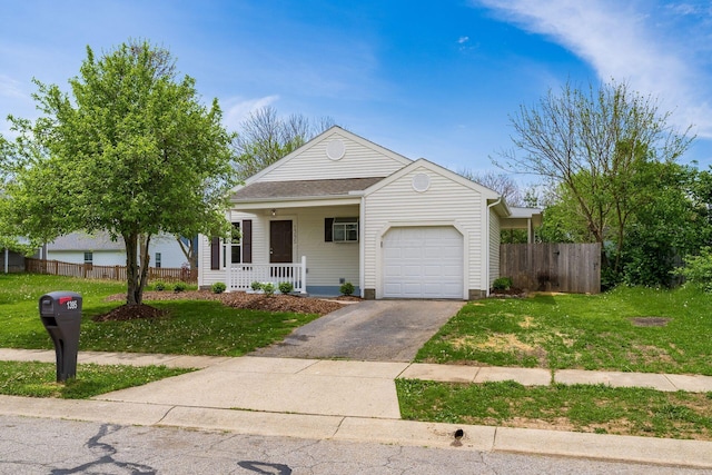 single story home featuring fence, covered porch, an attached garage, and driveway