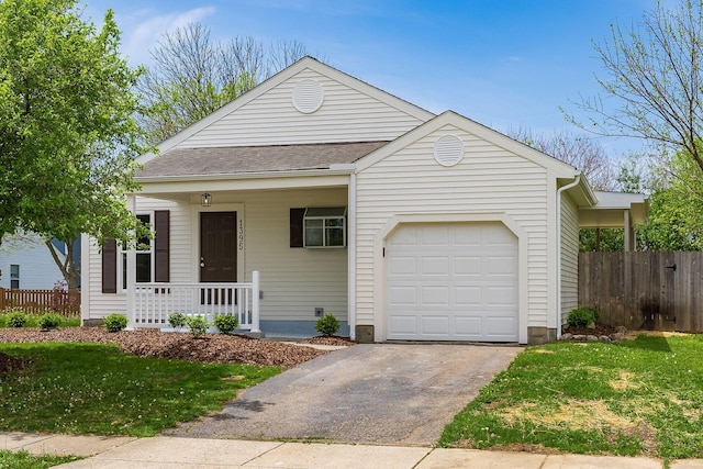 view of front facade with a porch, driveway, a front yard, and a garage