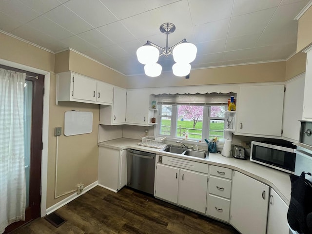 kitchen featuring a sink, appliances with stainless steel finishes, crown molding, and open shelves