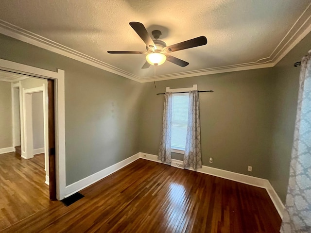 spare room with baseboards, a textured ceiling, ceiling fan, and wood finished floors
