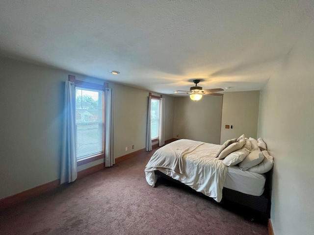 bedroom featuring carpet floors, baseboards, and ceiling fan