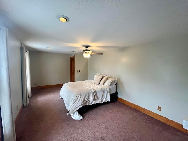 carpeted bedroom with a ceiling fan, baseboards, and visible vents