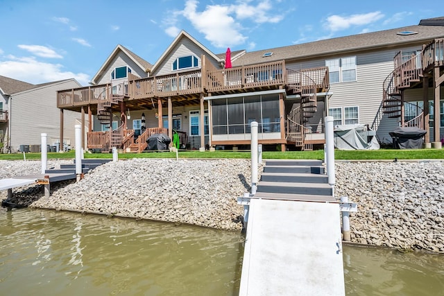 view of dock featuring a deck with water view and stairway