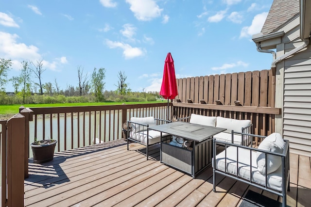 wooden deck with a water view