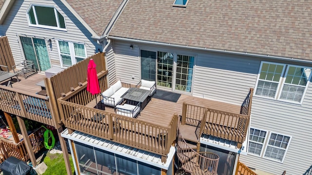 wooden terrace with outdoor lounge area