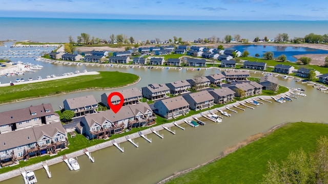 bird's eye view featuring a water view and a residential view