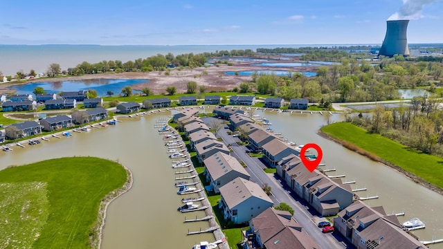 birds eye view of property with a residential view and a water view