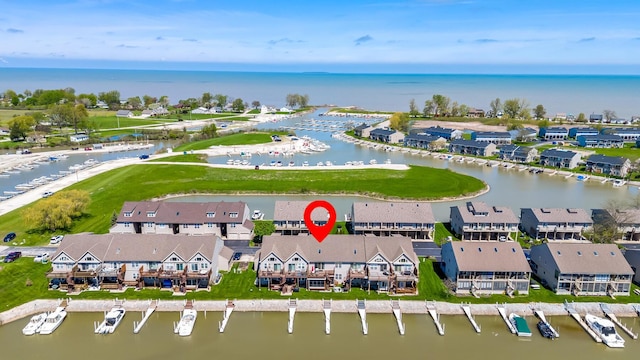 birds eye view of property featuring a water view