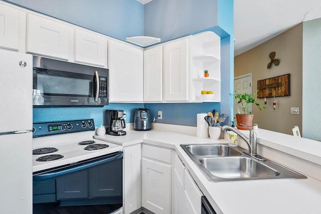 kitchen with a sink, white cabinets, white appliances, and light countertops