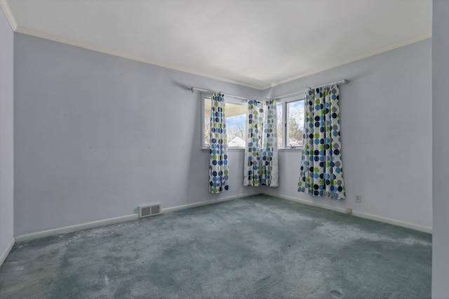 spare room with carpet flooring, baseboards, visible vents, and ornamental molding