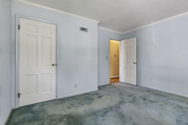 unfurnished bedroom with baseboards, ornamental molding, carpet flooring, and visible vents