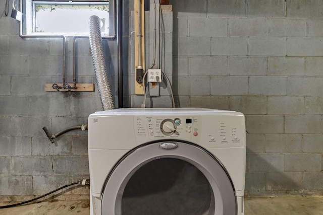 washroom featuring washer / dryer and laundry area