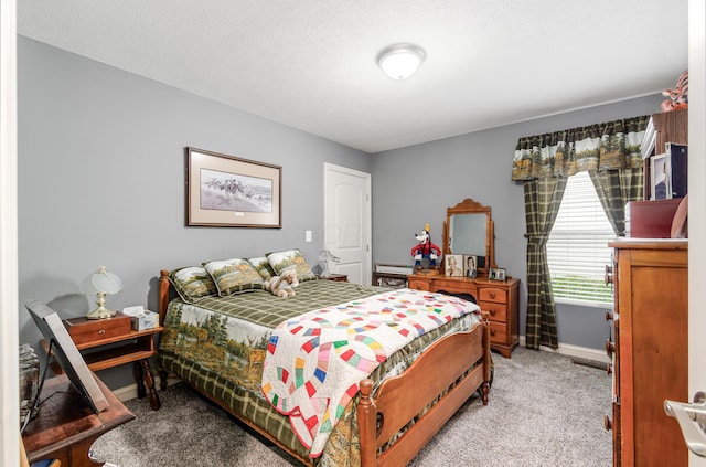 bedroom featuring baseboards and light carpet