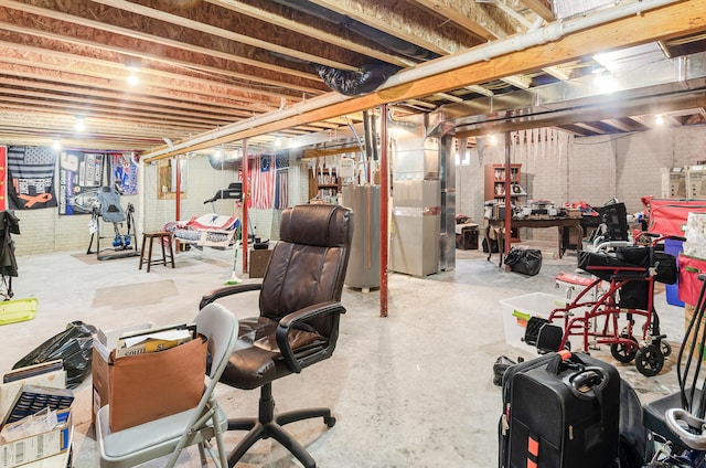 unfinished basement featuring heating unit and gas water heater