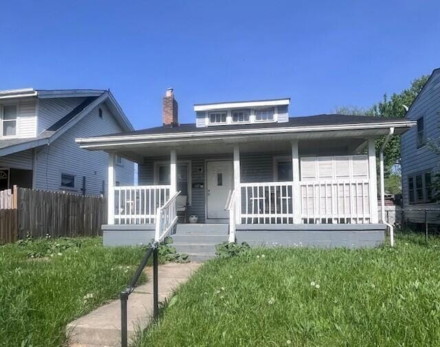 608 S Eureka Ave, Columbus, OH 43204 - bungalow-style house featuring a porch, fence, and a chimney