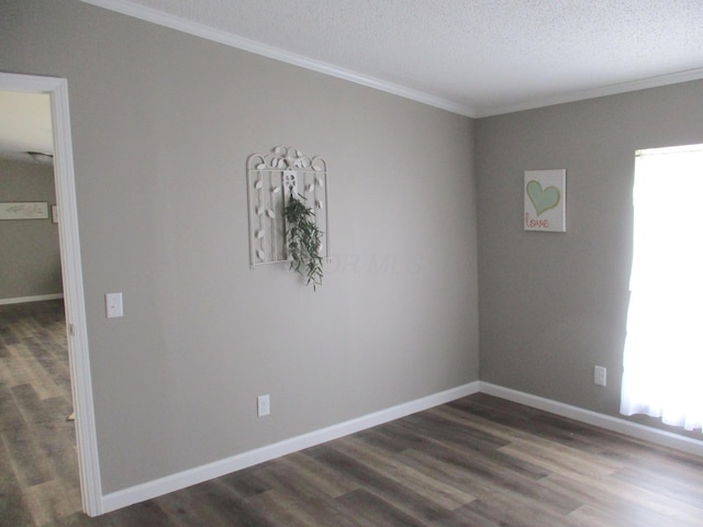 unfurnished room with crown molding, a textured ceiling, baseboards, and dark wood-style floors