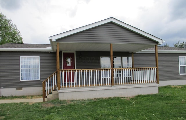view of front of property with a porch, crawl space, a shingled roof, and a front lawn