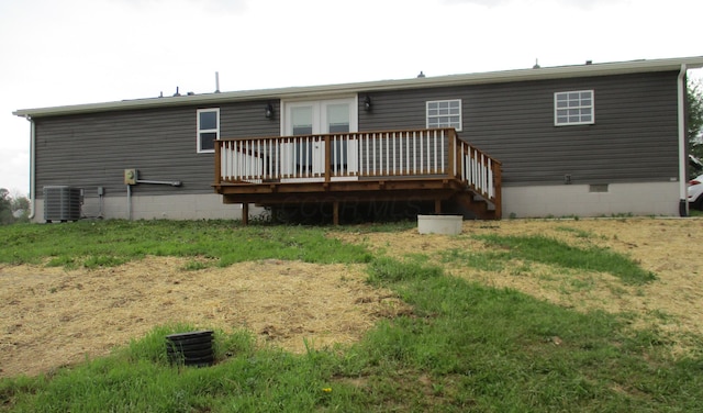 back of property with a wooden deck, central AC unit, and crawl space